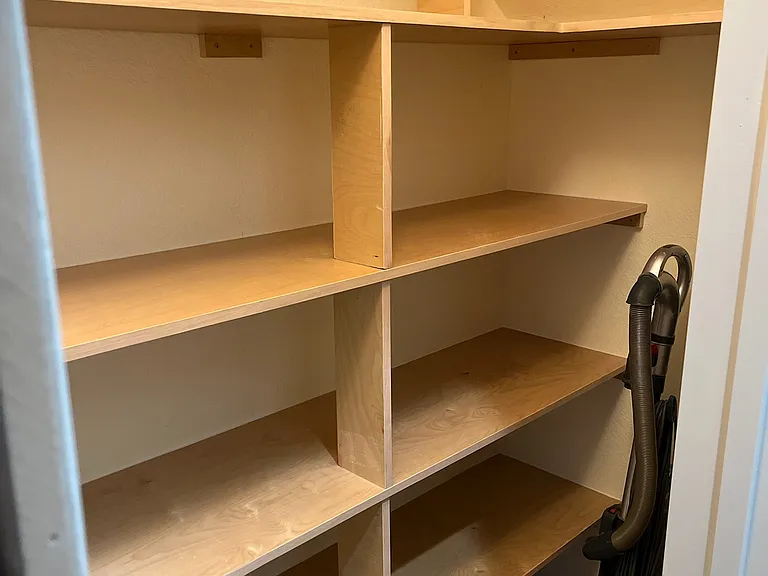 Pantry under stairs.