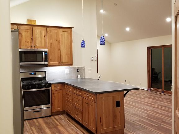 Kitchen peninsula looking into living/dining area