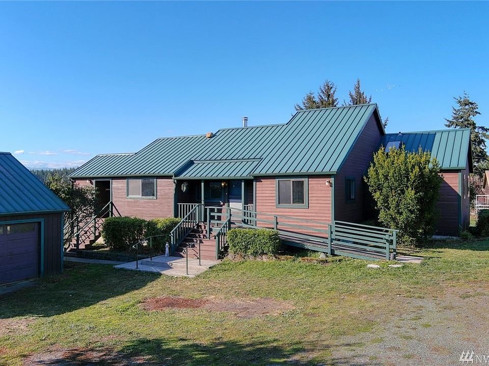 View home on 2.4 Acres.  Olympic Mountains just beyond the rolling pastures off of Hastings.  Metal roof and 2 car garage. Fenced and gated.