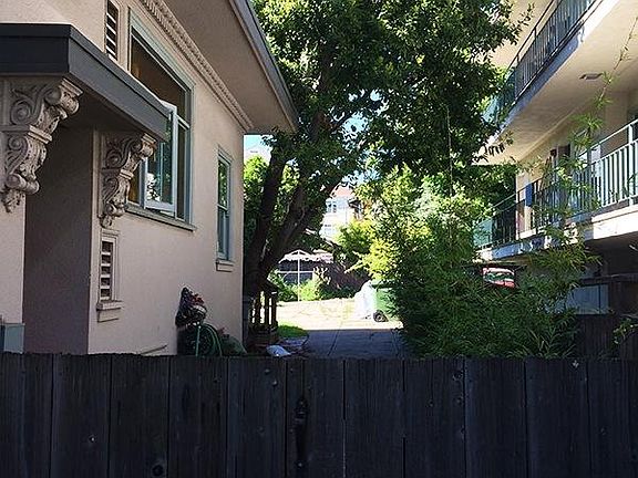 A fenced entry to the upstairs unit