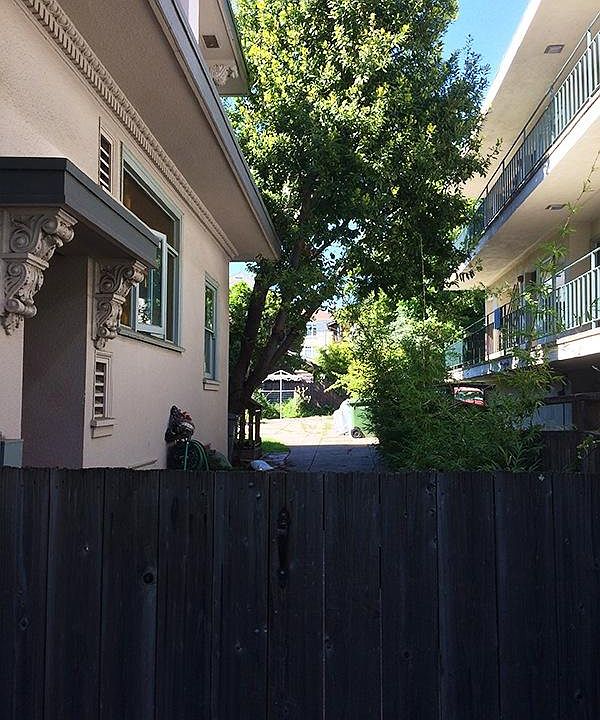 A fenced entry to the upstairs unit