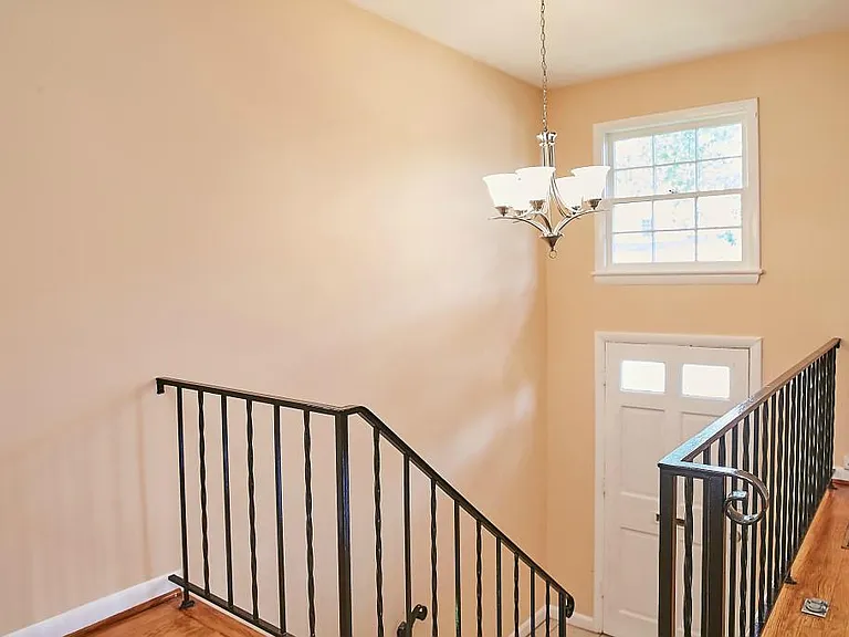 Upper level view of front door foyer