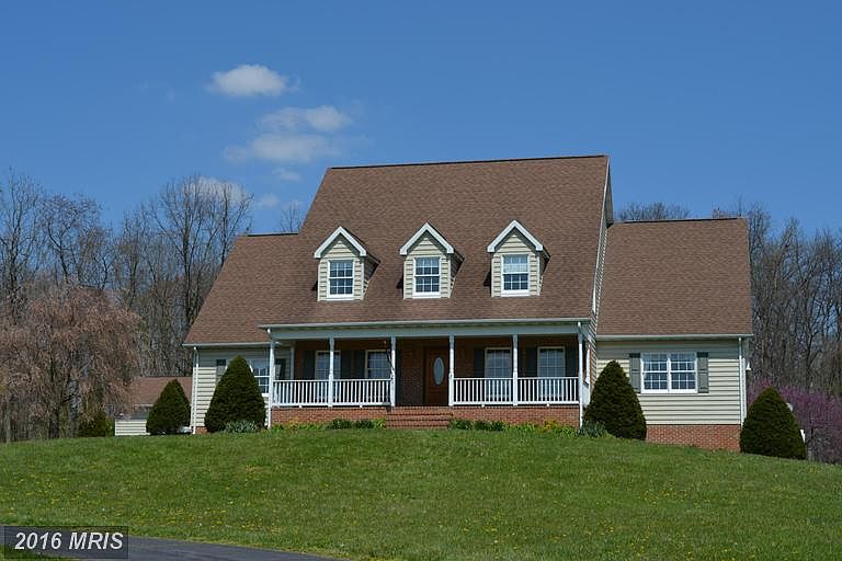 Beautiful Cape Cod home sits atop winding hill
