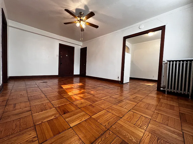 Parquet wood flooring throughout.