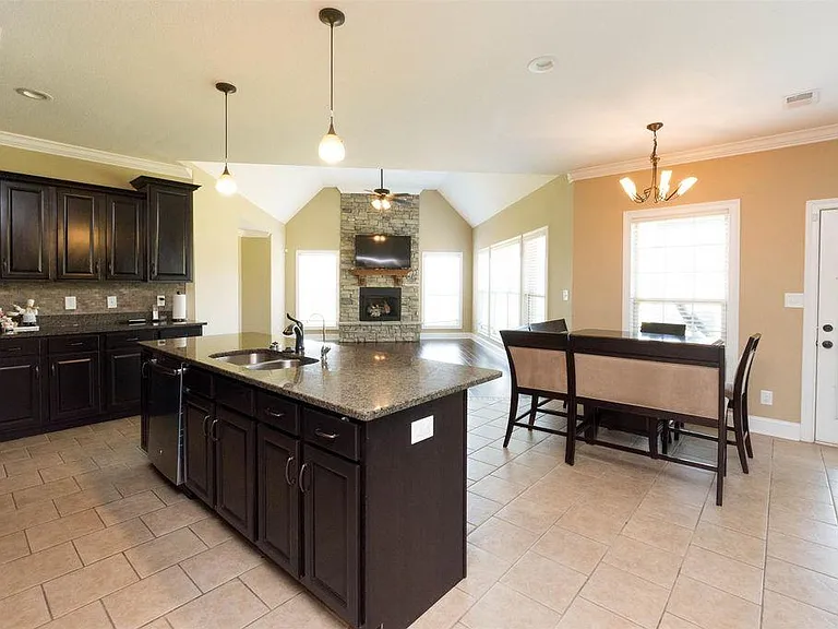 Family room connecting seamlessly to the eat in kitchen, ideal for gatherings and meals.