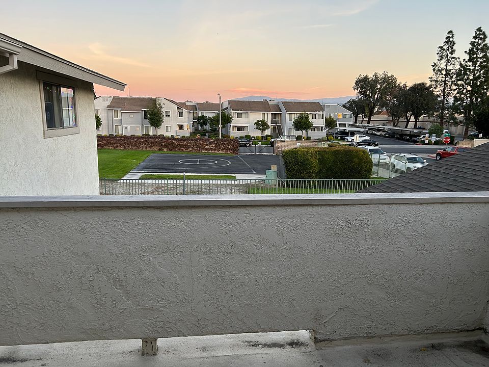 Large balcony overlooking the green space next door.