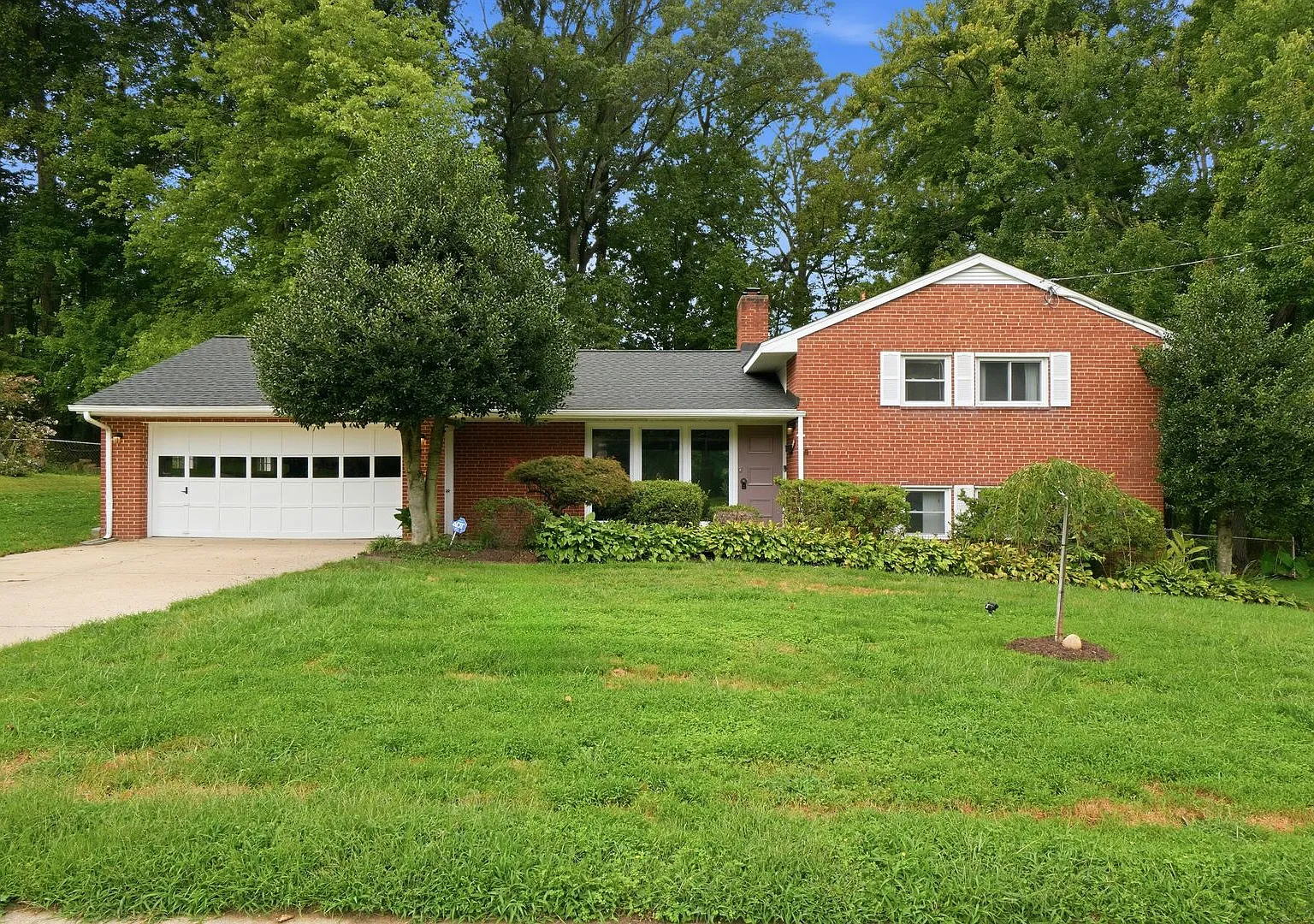 This beautifully maintained 4-bedroom, 2-bath single-family home offers generous living space, an... — Photo 1