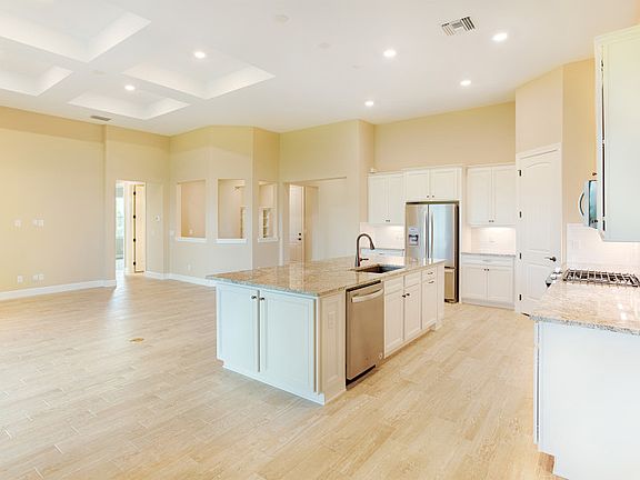 Kitchen with granite countertops and stainless gas appliances