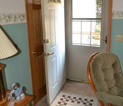 Once inside the entry opens into the Living room.  The coat closet has a 6 panel door.
