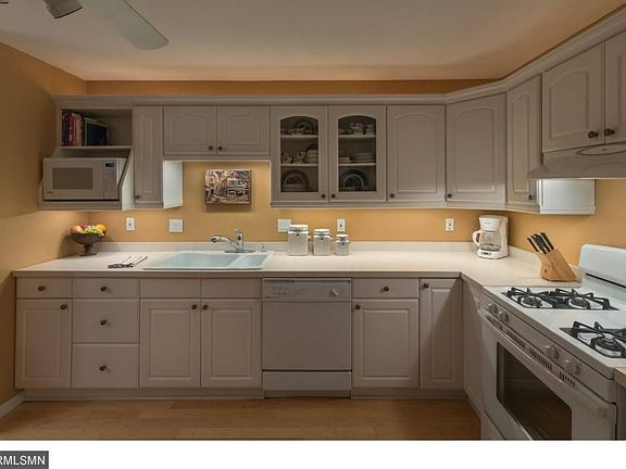 - Unique features include a full base cabinet of drawers, built-in shelves for a microwave and cook books, an asymmetrical sink, and a ??Lazy Susan?? in the corner base cabinet.