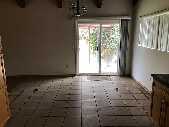 Dining room with glass slider entry to patio and back yard.