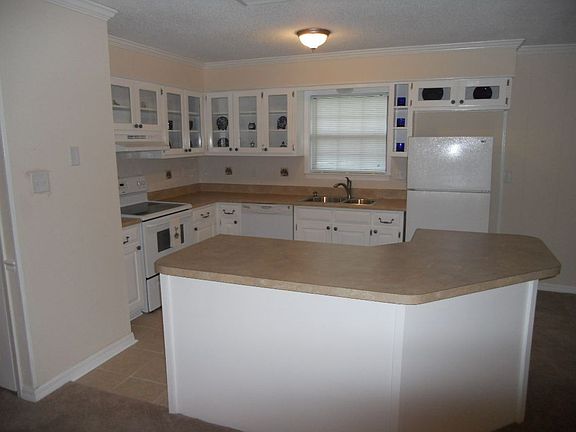 Kitchen w/ new countertops, tile backslpash, and ceramic tile!