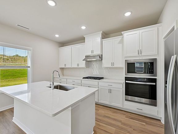 Kitchen in the Quinton floorplan at a Meritage Homes community in Zebulon, NC.