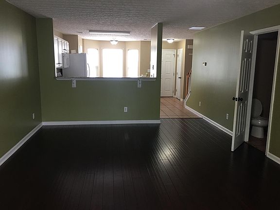Living room opens to kitchen