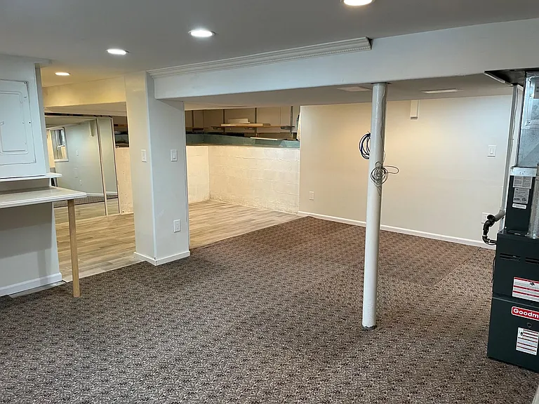 Open concept basement from the other side.