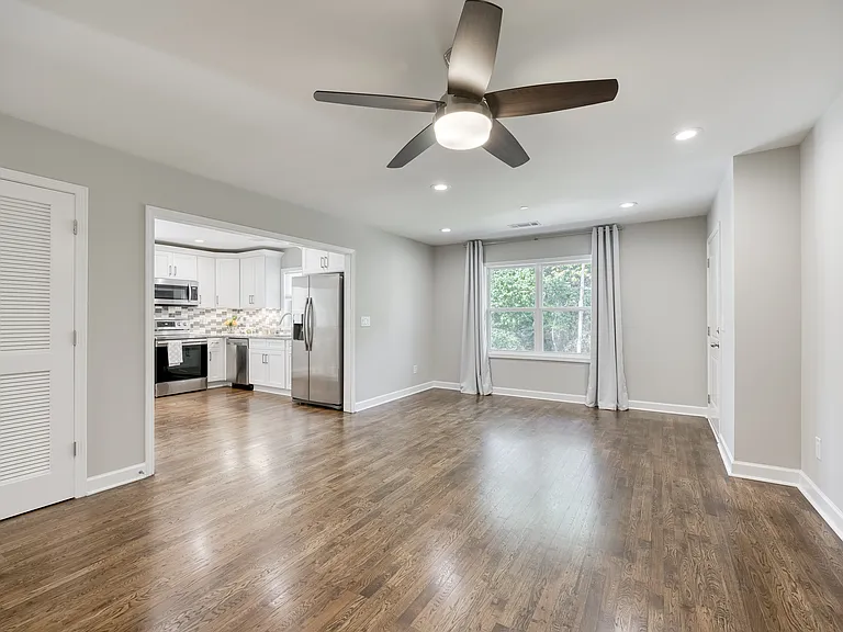 An open floor plan seamlessly connects the living room and kitchen.