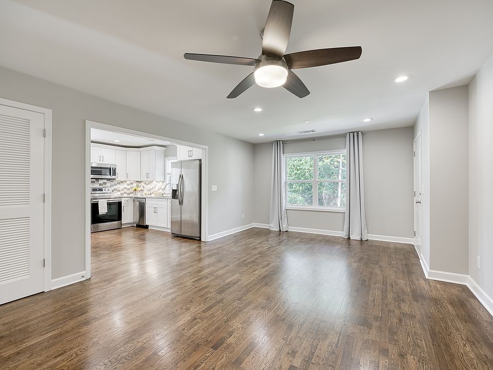 An open floor plan seamlessly connects the living room and kitchen.