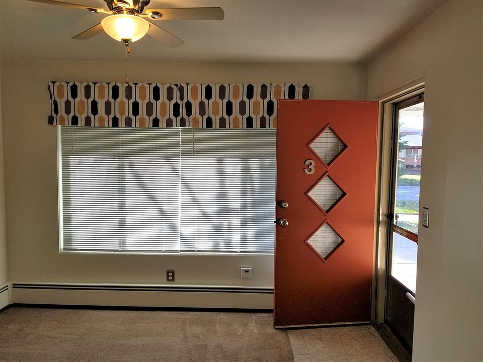 View from kitchen into living room/entry with South facing windows.