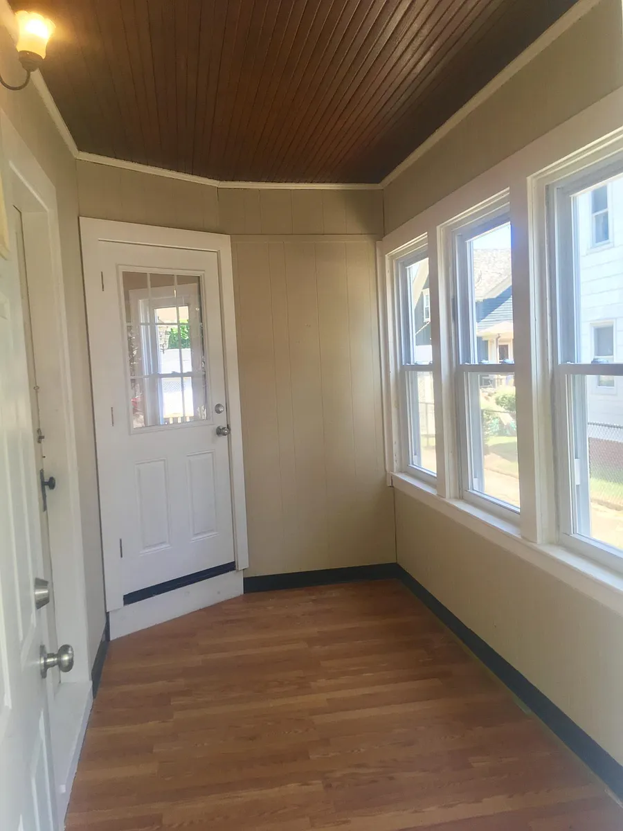 Private entry features 2 locking doors and finished 3 season room - 321 Main St #1