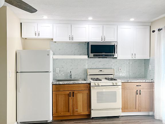 Kitchen has refrigerator, stove, microwave and plenty of cabinet space