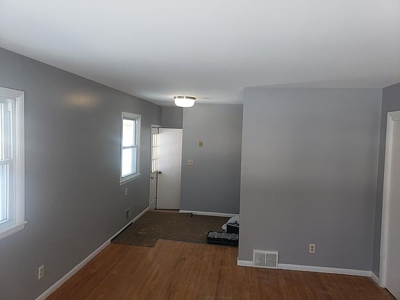 Living room facing towards kitchen wall
