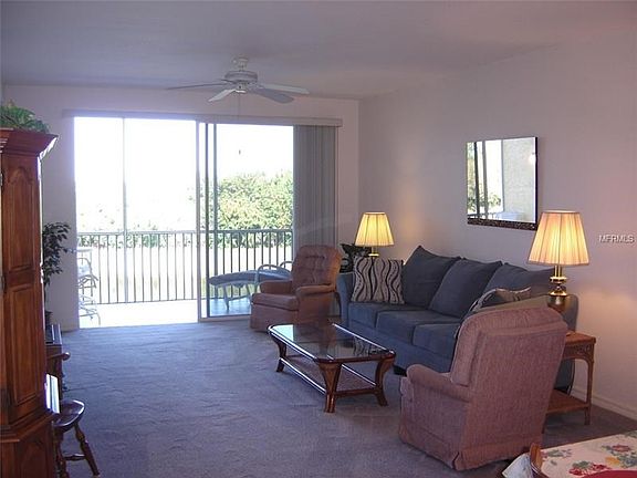 Large comfortable Living Room with sliding glass doors out to the balcony.