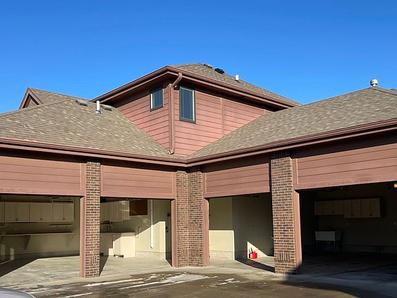 4 car heated garage with storage and drains