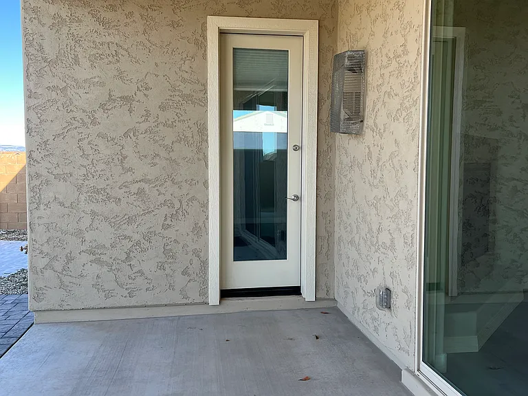 Covered Patio with French Door to Bedroom