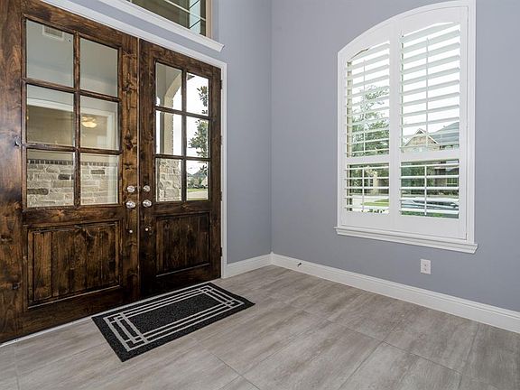 Gorgeous double doors open to a fabulous home we can't wait to show you!