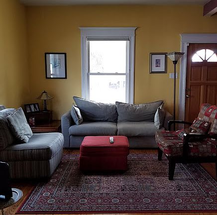 Diningroom look into livingroom and front of house
