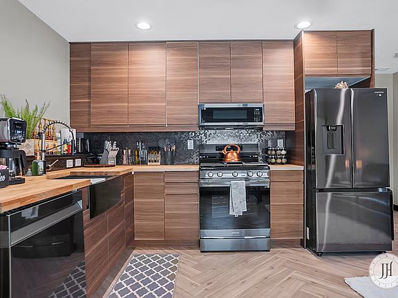 Modern, fully equipped kitchen featuring a dishwasher, stove, oven, and coffee maker_perfect for cooking and enjoying your favorite meals.