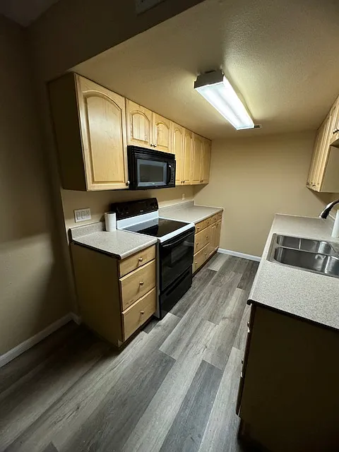 Workable kitchen. Refrigerator will be installed.