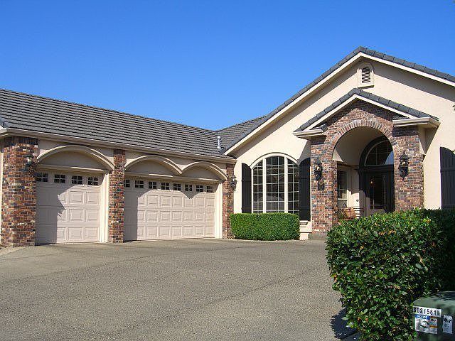 Front of Home,Triple car garage on left,note tile roof