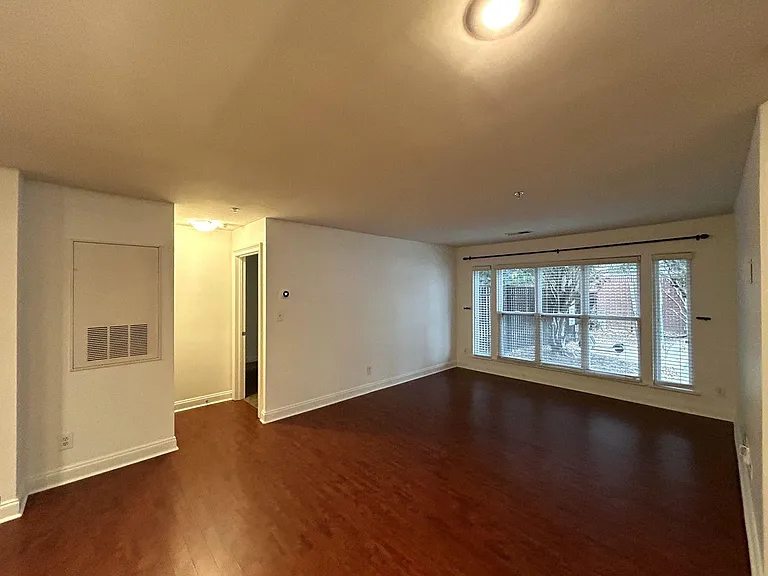 Open-concept layout where the kitchen flows seamlessly into the living area, creating a bright and inviting main space perfect for entertaining or relaxing.