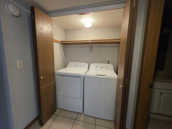 Washer and dryer with storage space