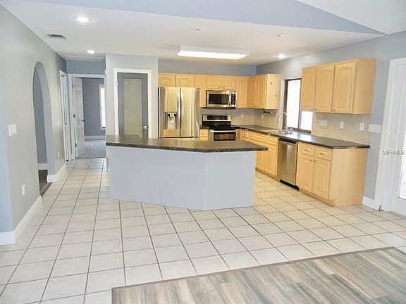 View of kitchen looking from Family room.