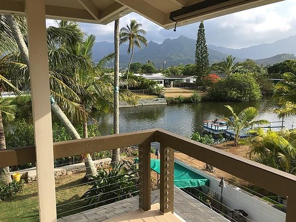 Deck view of canal, Mt. Olomana, and Koolau mountains.