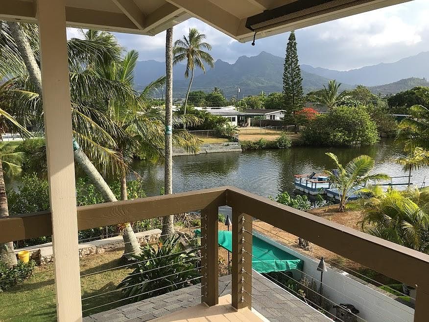 Deck view of canal, Mt. Olomana, and Koolau mountains.