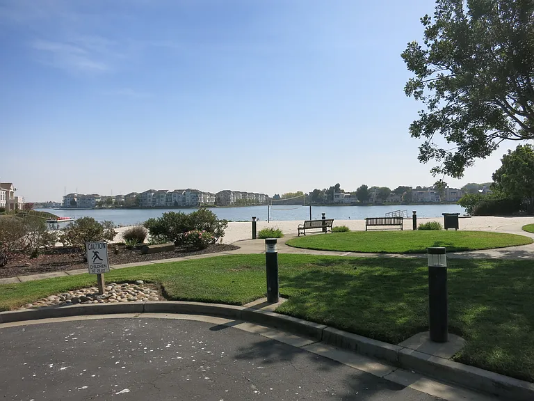 Community park overlooking the beach volleyball court and lagoon