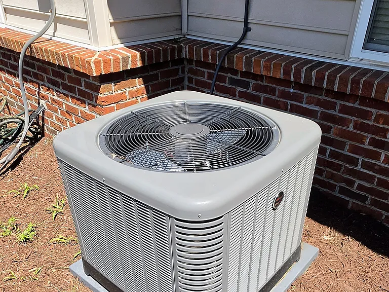 High-efficiency central air conditioning system, meticulously maintained to ensure optimal climate control and low seasonal utility costs (Installed in 2025) .