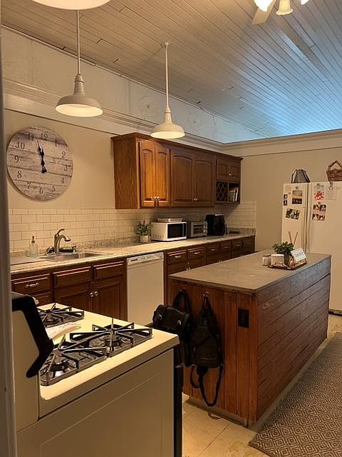 Spacious kitchen with tons of cabinets and an island and a eating nook
