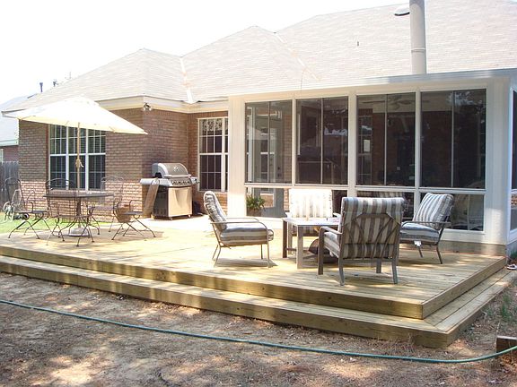 sunroom and deck overlook huge back yard