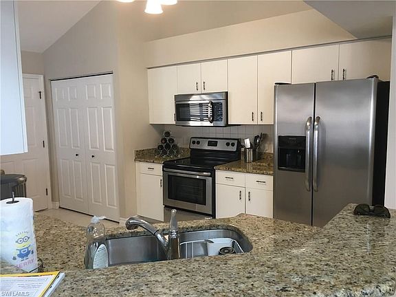 Kitchen with SS appliances and granite counters
