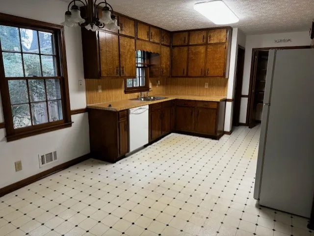 kitchen from dining area - 507 Summerville Dr