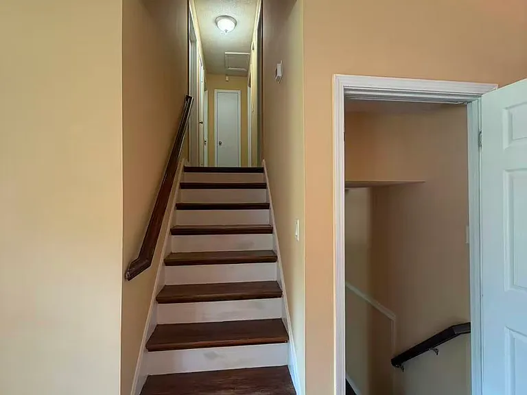 stairways to second floor bedrooms and bedroom/bonus rooms downstairs