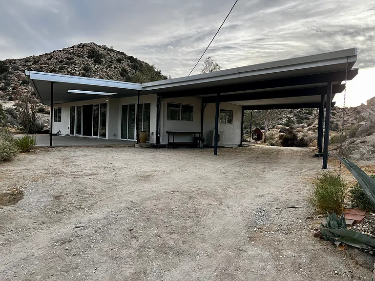 Carport with a front and back driveway