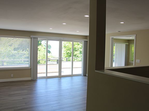 Living room with doors to deck