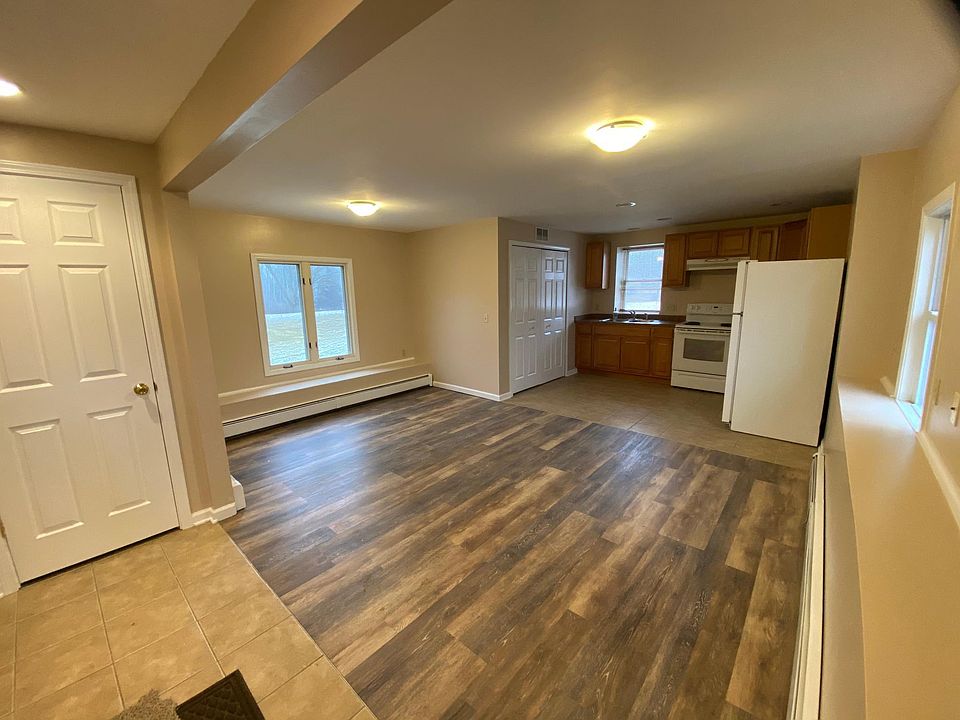 Living area w/new flooring and new paint throughout; great natural light with efficient windows; W/D hookups in large utility closet in kitchen; Large walk-in closet in entryway.
