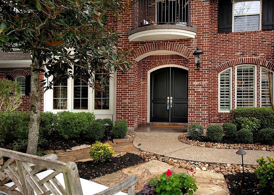 Elegant double doors greet your guests arrival at this stunning traditional home.