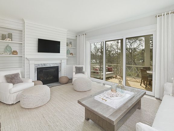 Unwind in the cozy Gathering Room of the Sandpiper townhome in Kiawah River